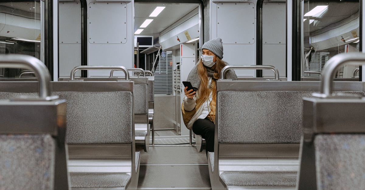 Travelling to Paris by train during a strike in December 2019 - Woman Wearing Mask on Train