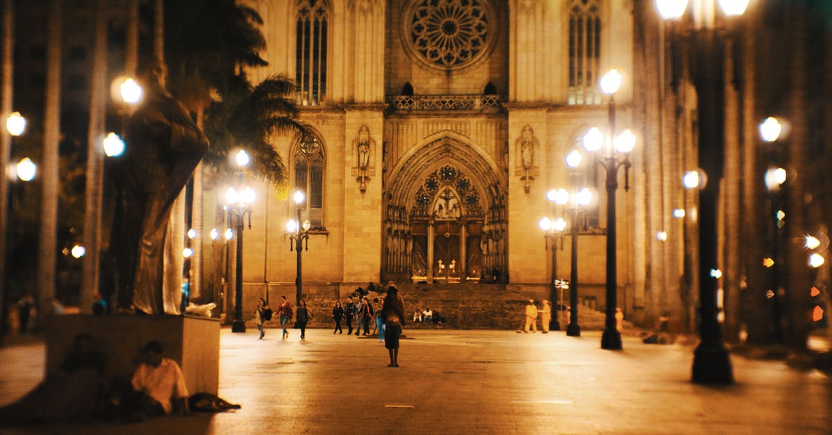 Travelling to Peru, should I include Brazil in my trip? [closed] - Facade of ancient Catholic church located on square with lanterns and palm trees at night