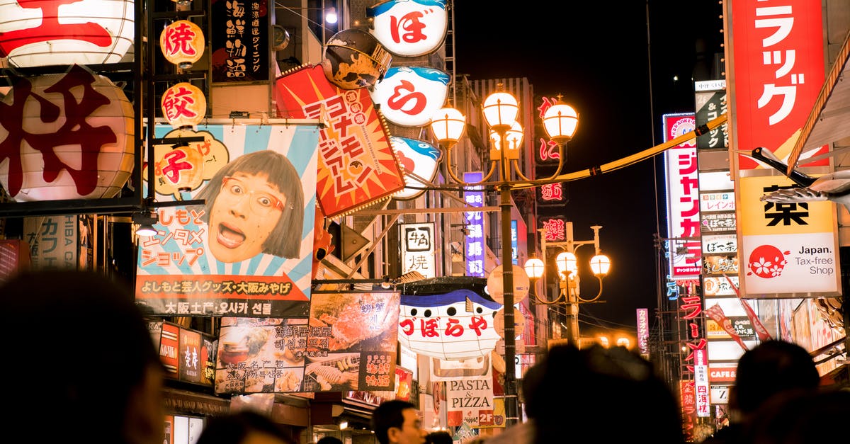 Travelling to Taipei (Taiwan) with expired Japan Single Entry Tourist Visa - Crowd Surrounded by Buildings during Night Time