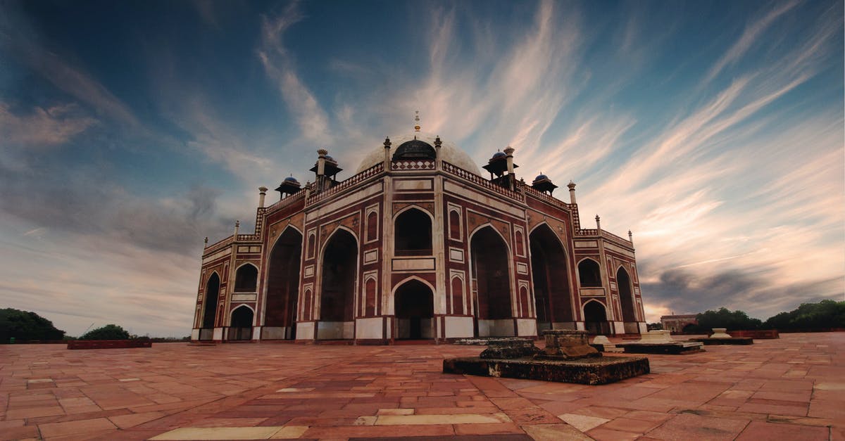 Travelling while afflicted with Delhi Belly? - Brown and Black Mosque Under White and Blue Cloudy Sky