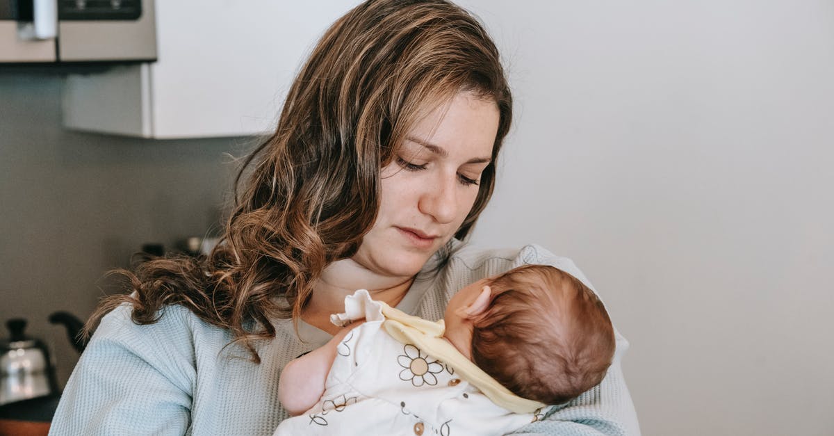 Travelling with Infant to Hong Kong - Need to use Kitchen - Mother with newborn baby in kitchen