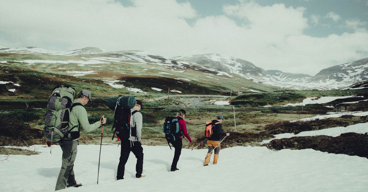 Trekking in Georgian Tusheti region? Safety? - People Hiking on Snow Covered Mountain