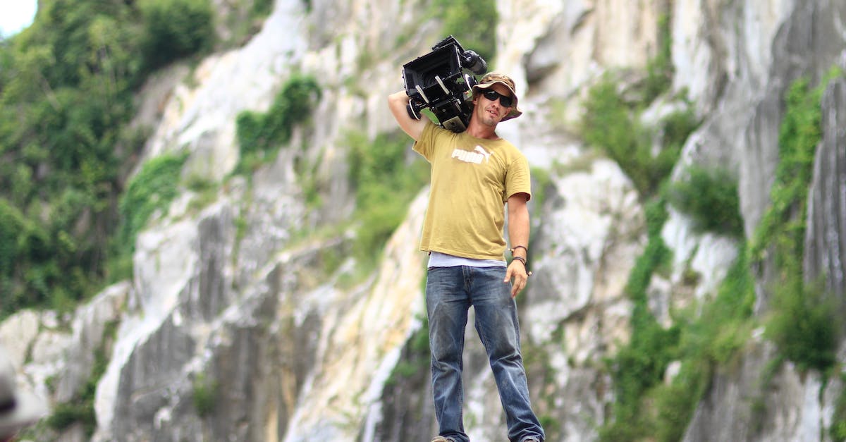 Trekking tips to Langtang [closed] - Man Standing on Rock While Holding Black Case