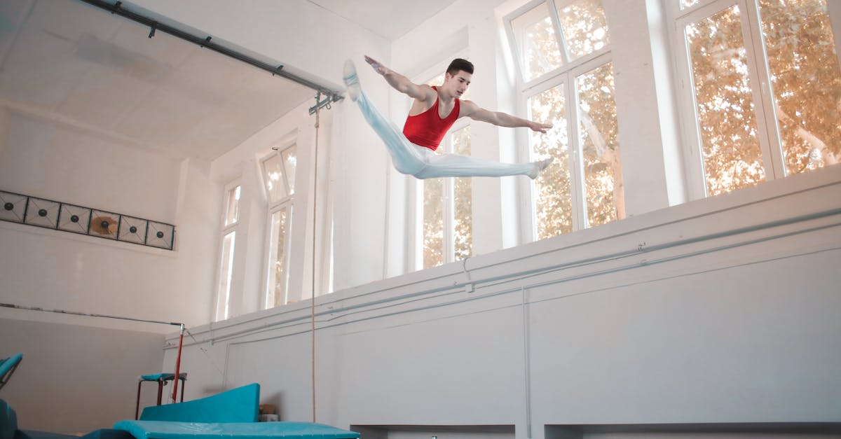 Trick to breaking down air routes - Young professional gymnast jumping on trampoline