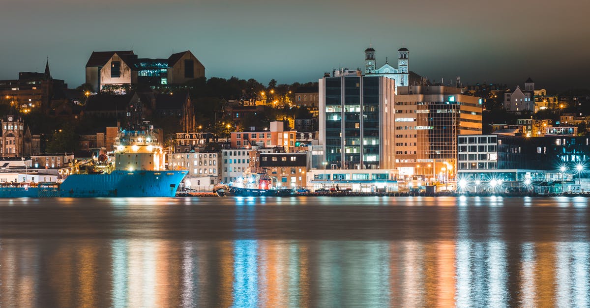 Trip to Canada for EU citizen: visa requirements? - Various ships moored in harbor of coastal illuminated city at night