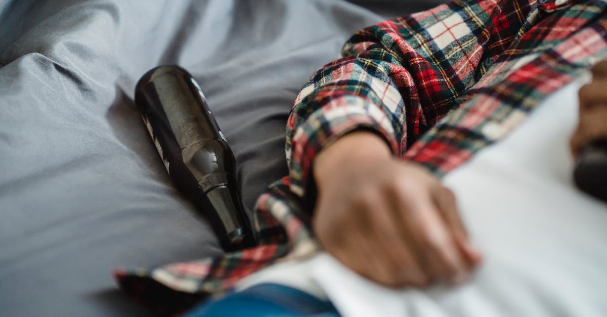 Triple Citizenship [closed] - Person in Red Black and White Plaid Dress Shirt Holding Black Microphone