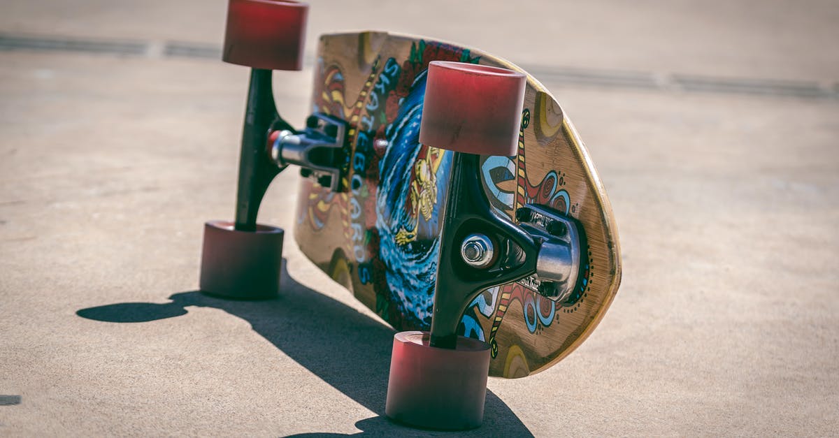 trolleys with exchangeable wheels [closed] - Shallow Focus Photography of Brown and Blue Skateboard