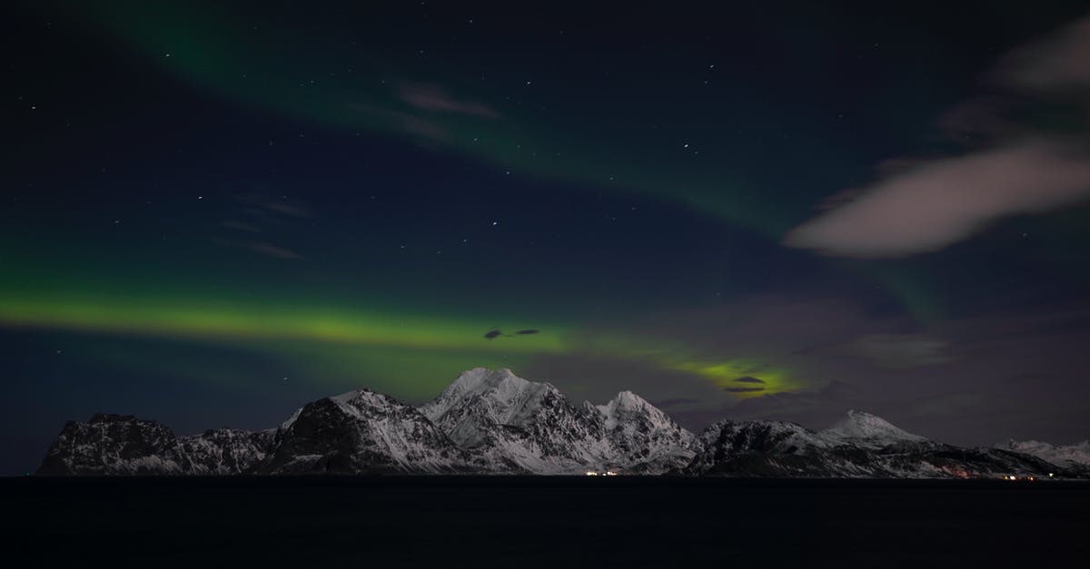 Tromsø Aurora Borealis tours - Snow Covered Mountain Under Blue Sky