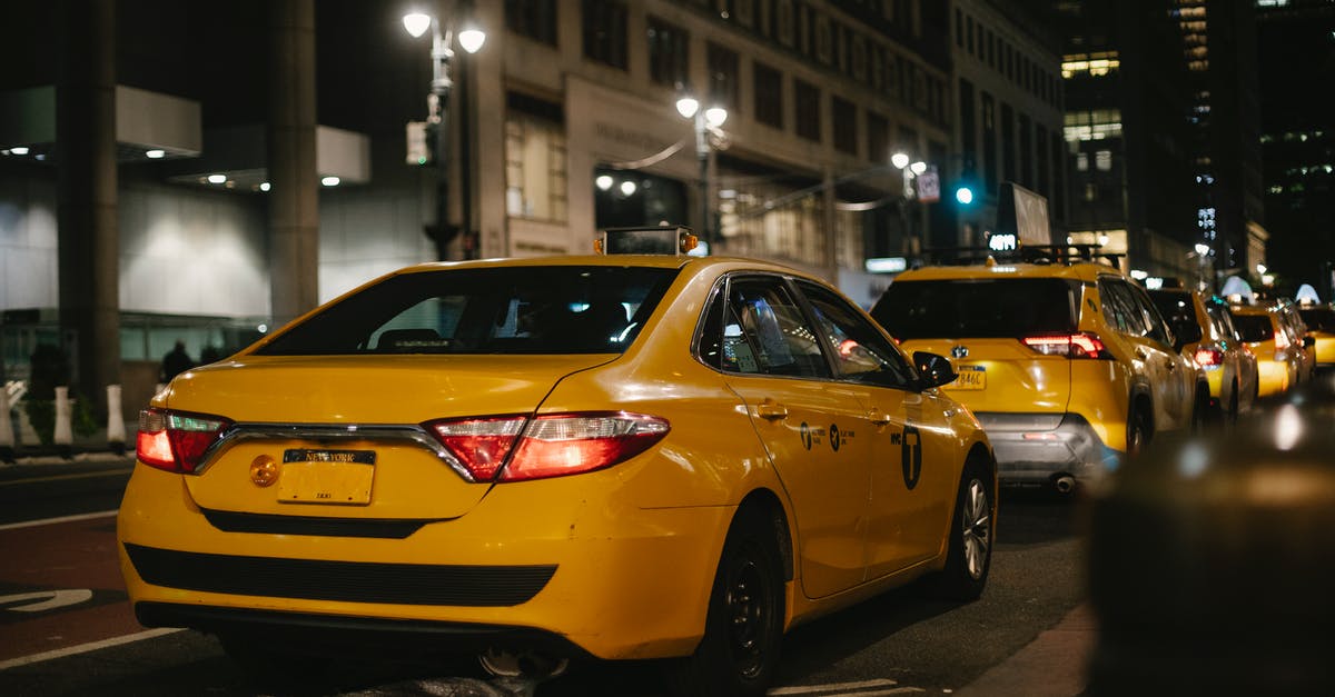 Truck rental, Mexico pick-up, U.S. drop-off - Yellow cabs driving along road at night