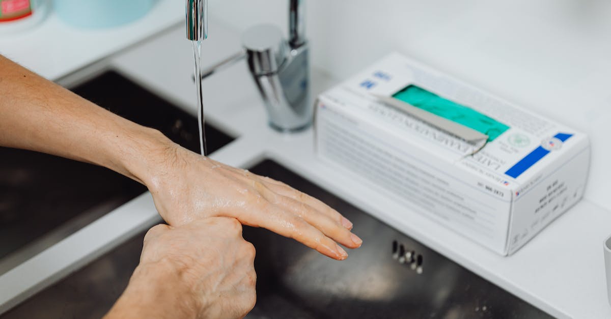 Truth about Georgian tap water - Doctor Washing Hands under Tap Water