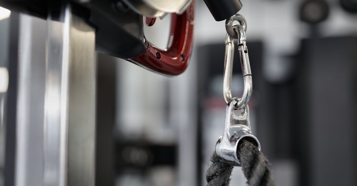 TSA Security for oversized items? - Black rope of modern exercise machine hanging on metal carabiner