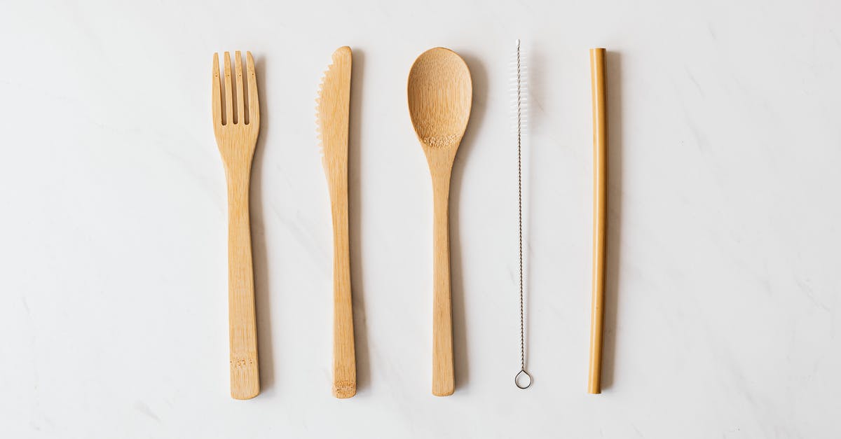 Tube from Heathrow to King's Cross - Wooden cutlery and tube with brush on marble table