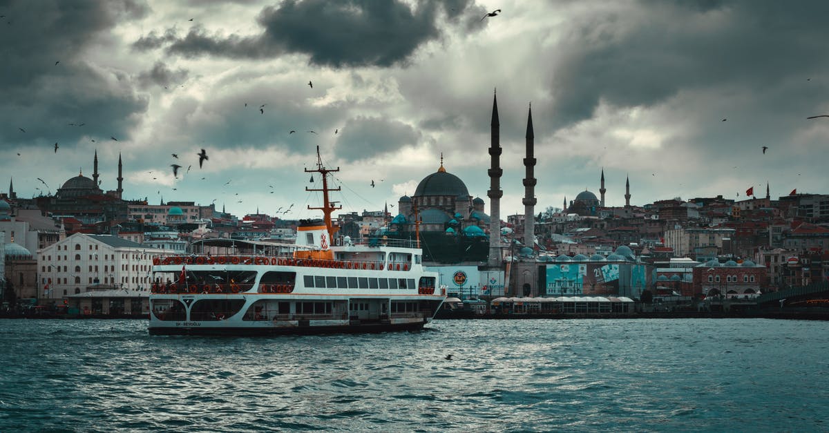 Turkey e-visa with expired H-1B but valid I-797A - Boat floating on river in old city on overcast day