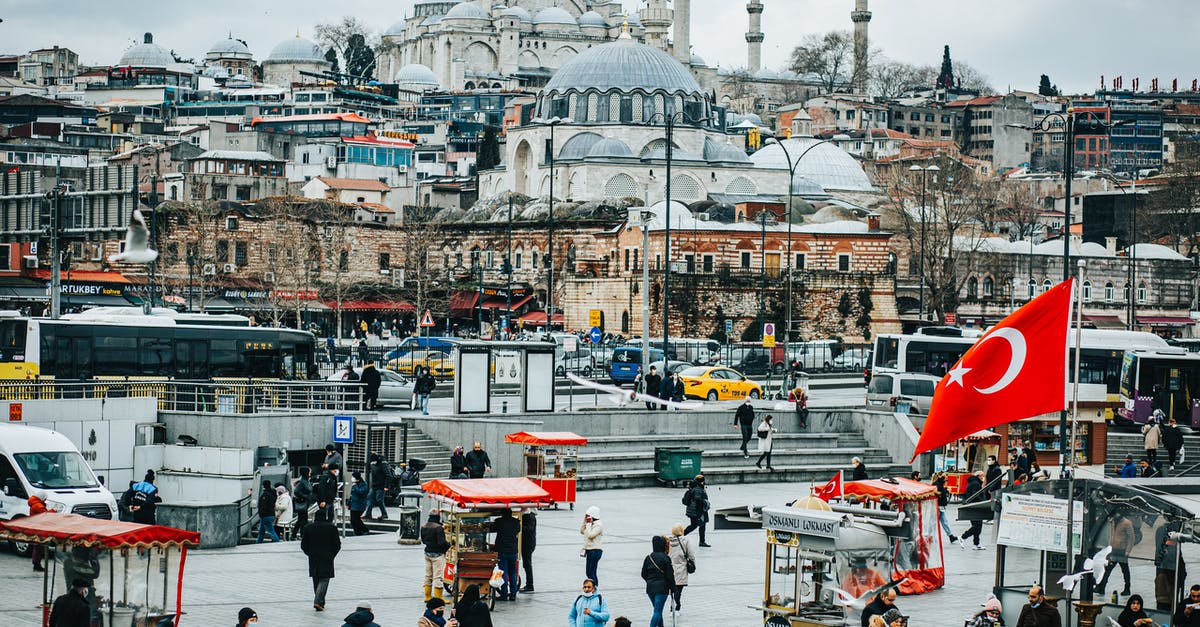 Turkey tourist e-visa with expired H-1B but valid i-797A - City square with people and buildings near vehicles