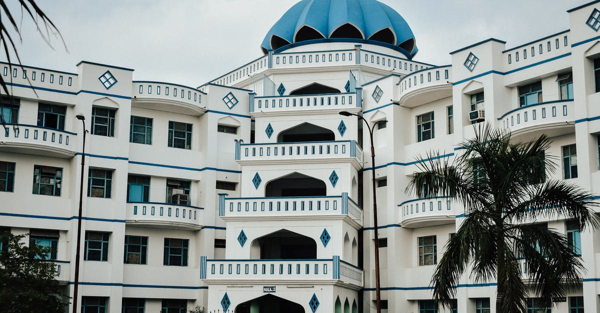 Two international connections from India to Canada via Bangkok and Tokyo - White and Blue Concrete Building