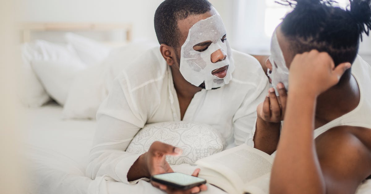 Two passports, two different names, booked a flight - Two Men in Bedroom with Cosmetic Masks on Faces