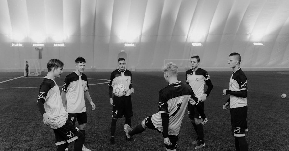 Two Weeks in Cambridge (England), practicing sport in group - Grayscale Photo of Soccer Players Practicing