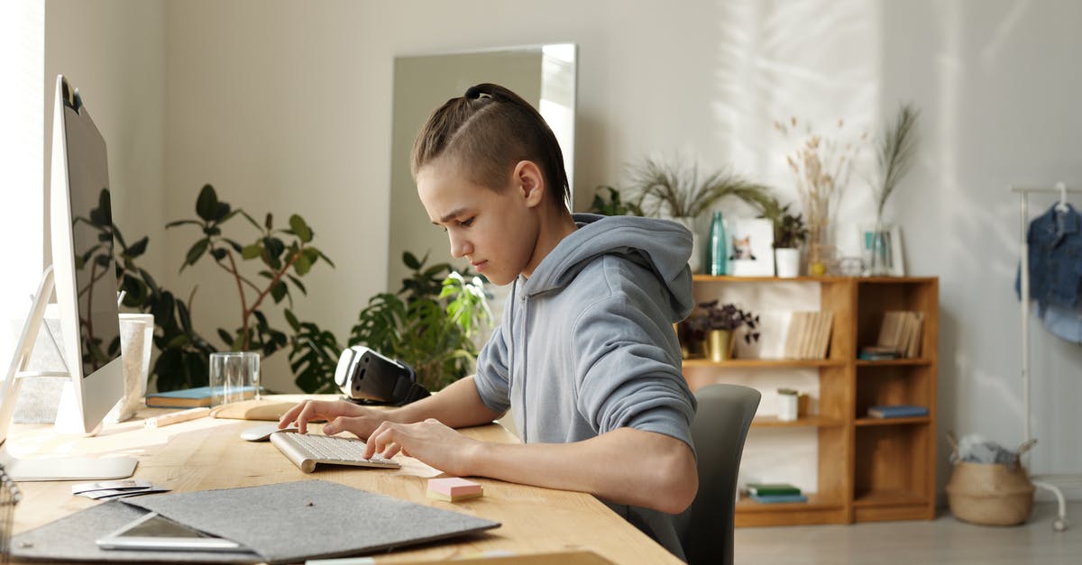 Type D student visa in Spain: valid date and duration of stay - Boy in Gray Hoodie Sitting on Black Chair