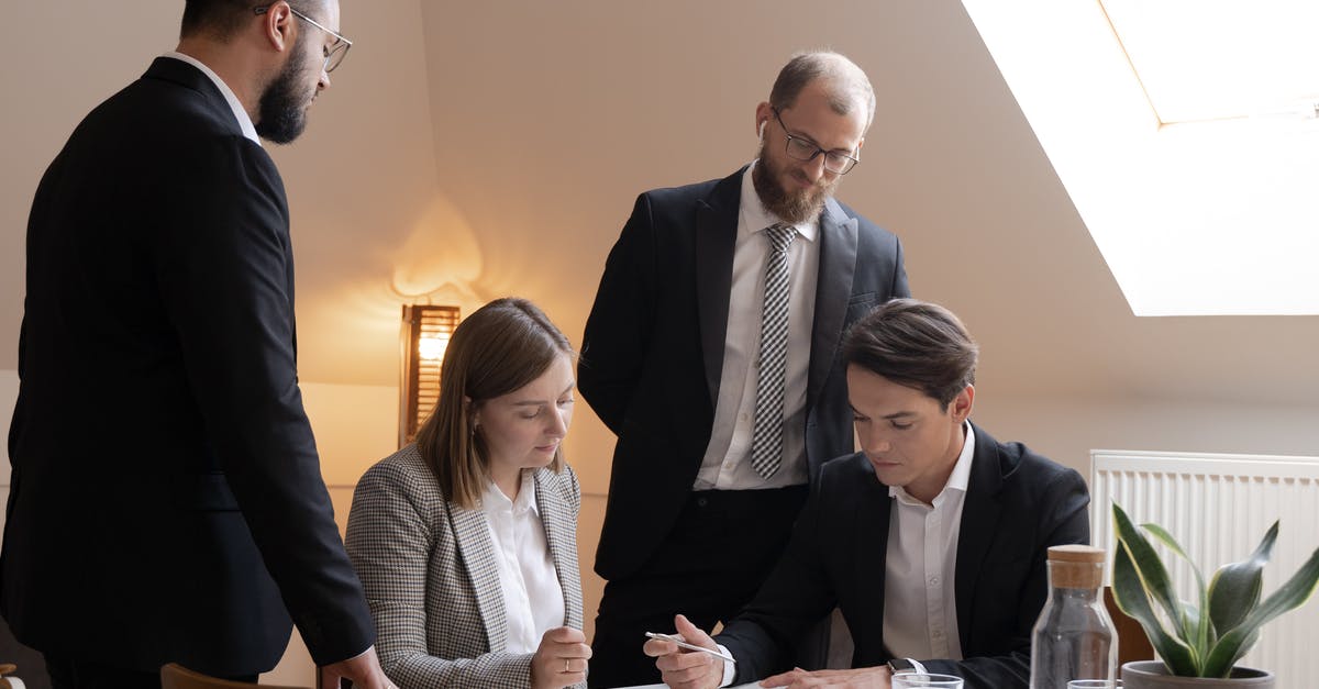 Type of Visa for attending a conference in Norway [duplicate] - Man in Black Suit Jacket Sitting Beside Woman in Gray and White Long Sleeve Shirt