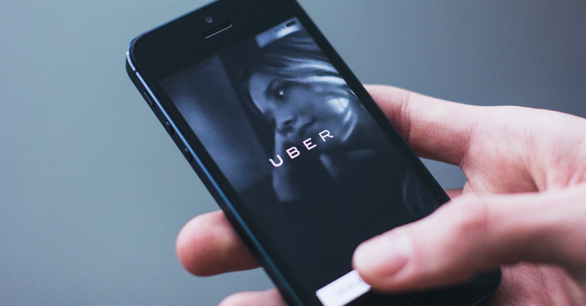 Uber or taxi from Porto Alegre airport? [closed] - Person Holding Smartphone