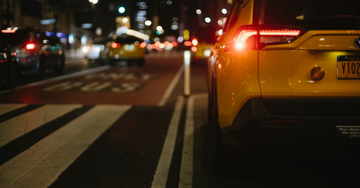 Uber-style rideshare/taxi services in Mongolia? - Stylish yellow SUV automobile driving on city street at night