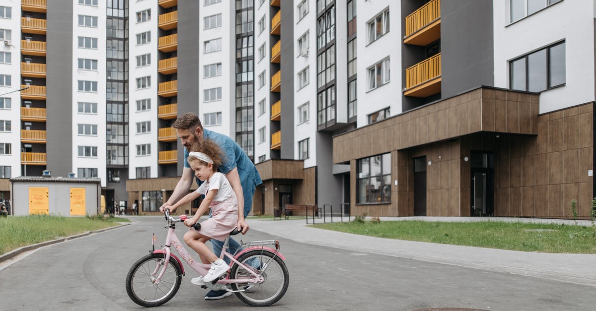 UIAA membership and guides - A Man Teaching His Daughter How to Ride a Bike