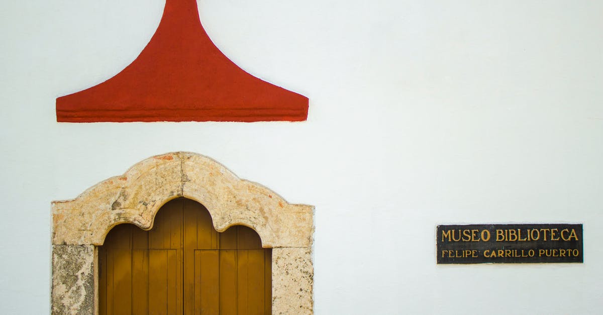 UK - Spousal Visa Travelling to Mexico for Holiday - Traditional Mexican building with aged wooden door in sunlight