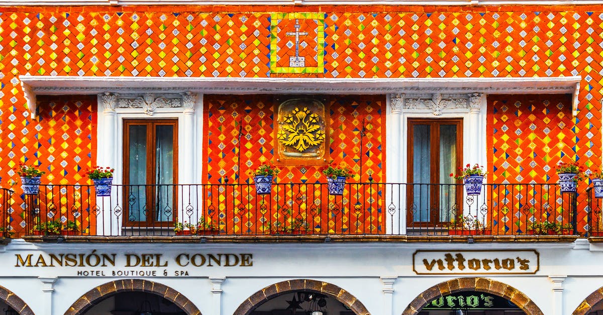 UK - Spousal Visa Travelling to Mexico for Holiday - Exterior of aged building of hotel decorated with traditional colorful Talavera Mexican tiles located in Atlixco