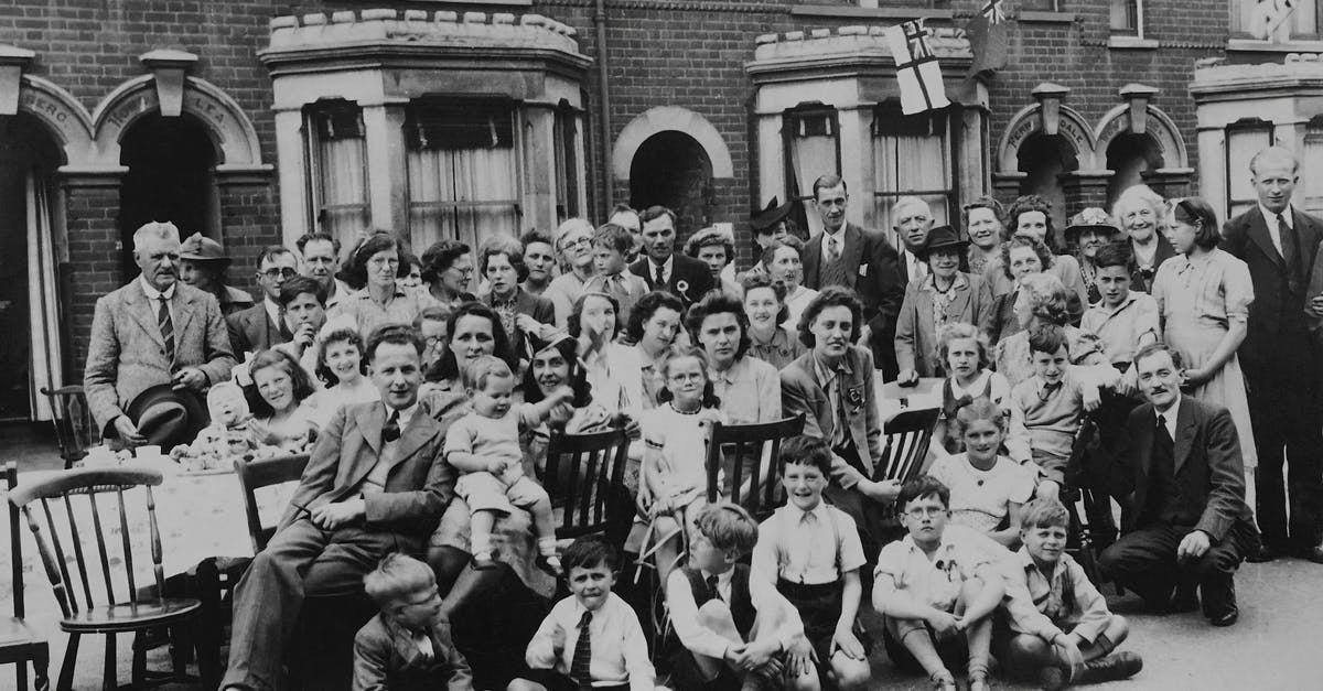 UK child visitor visa - A Grayscale Photo of People on the Street 