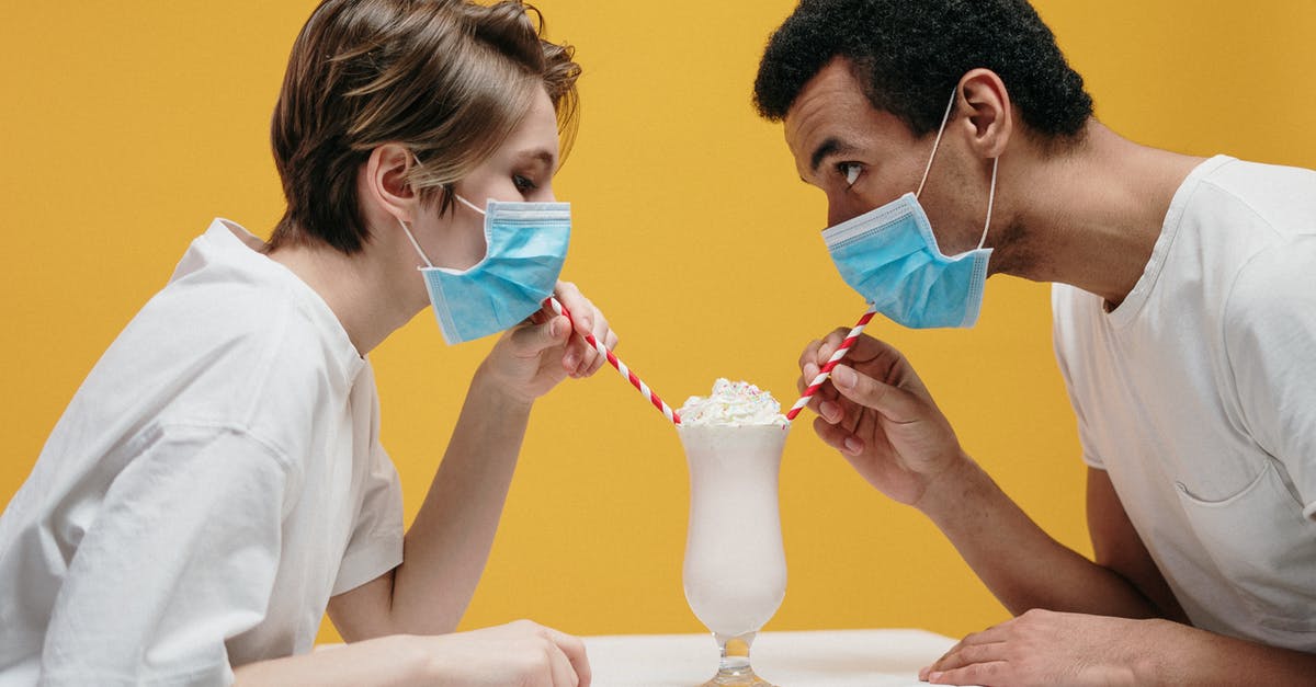 UK COVID Test-to-release programs starting date - Couple Wearing Face Mask Drinking Milkshake