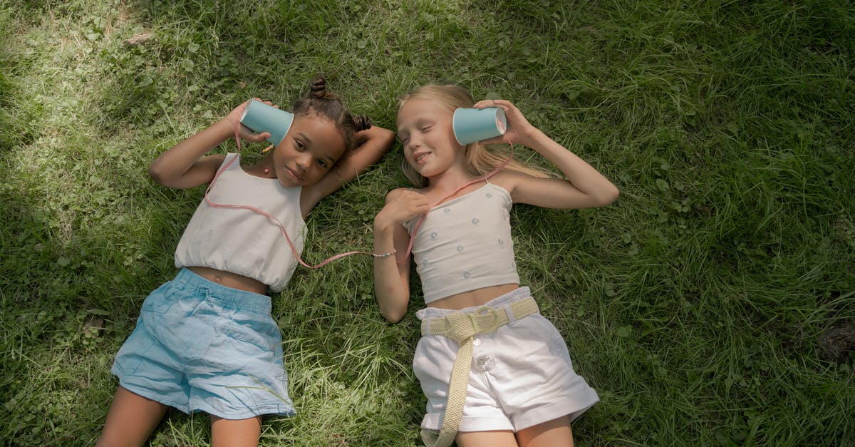 UK day two test switchover date? - Two Girls Laying on Lawn and Playing