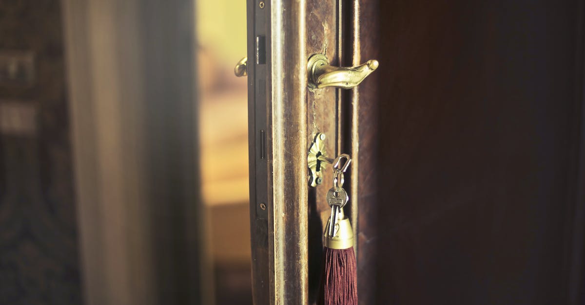 UK entry denied: how to go about ensuring access next time - Key with trinket in shabby door