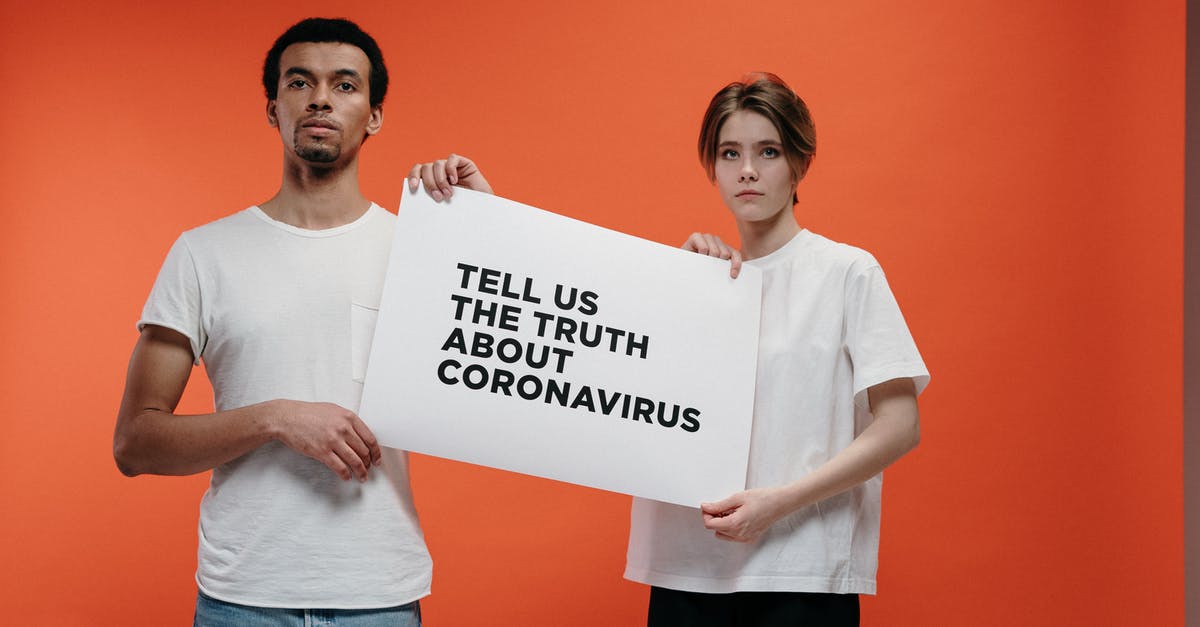 UK Public Health Passenger Locator Form: Privacy and Data Retention Period - People Holding A Poster Asking About The Truth In Coronavirus