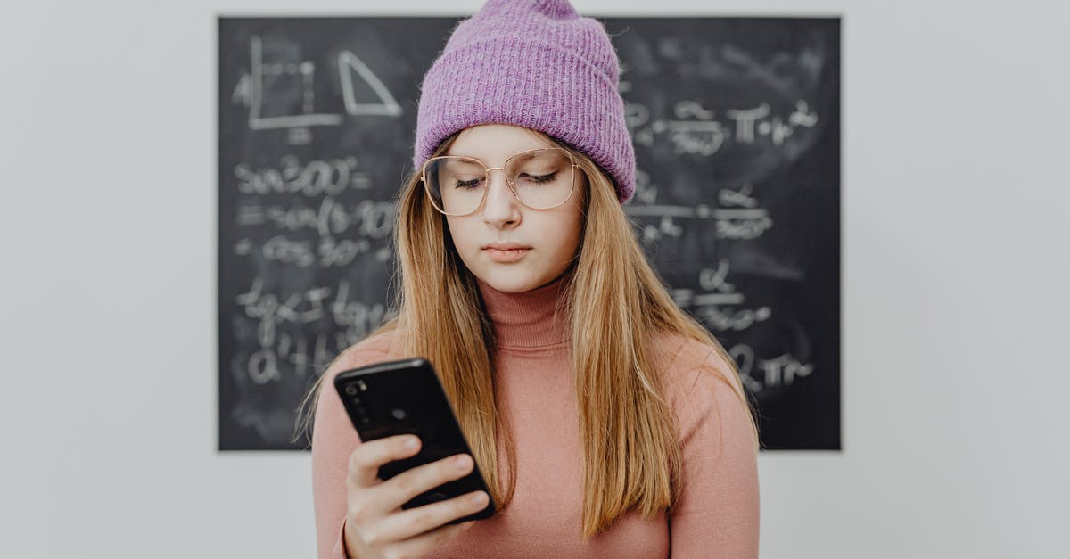 UK student visa, no sponsor, possible? - Woman in Orange Shirt Holding Black Smartphone