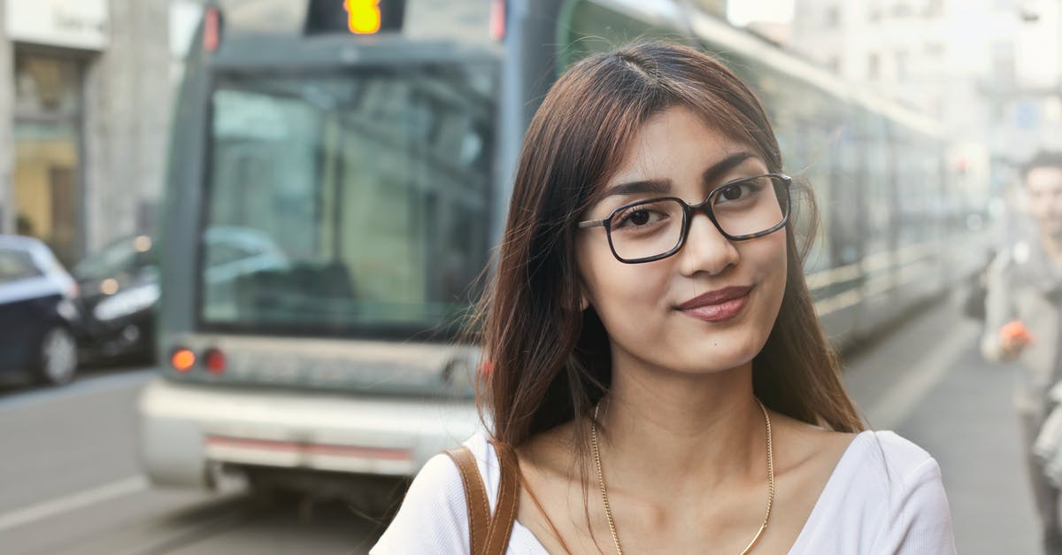 UK: Train vs. Car in 2015 [closed] - Woman in White Shirt With Eyeglasses Standing Near Train