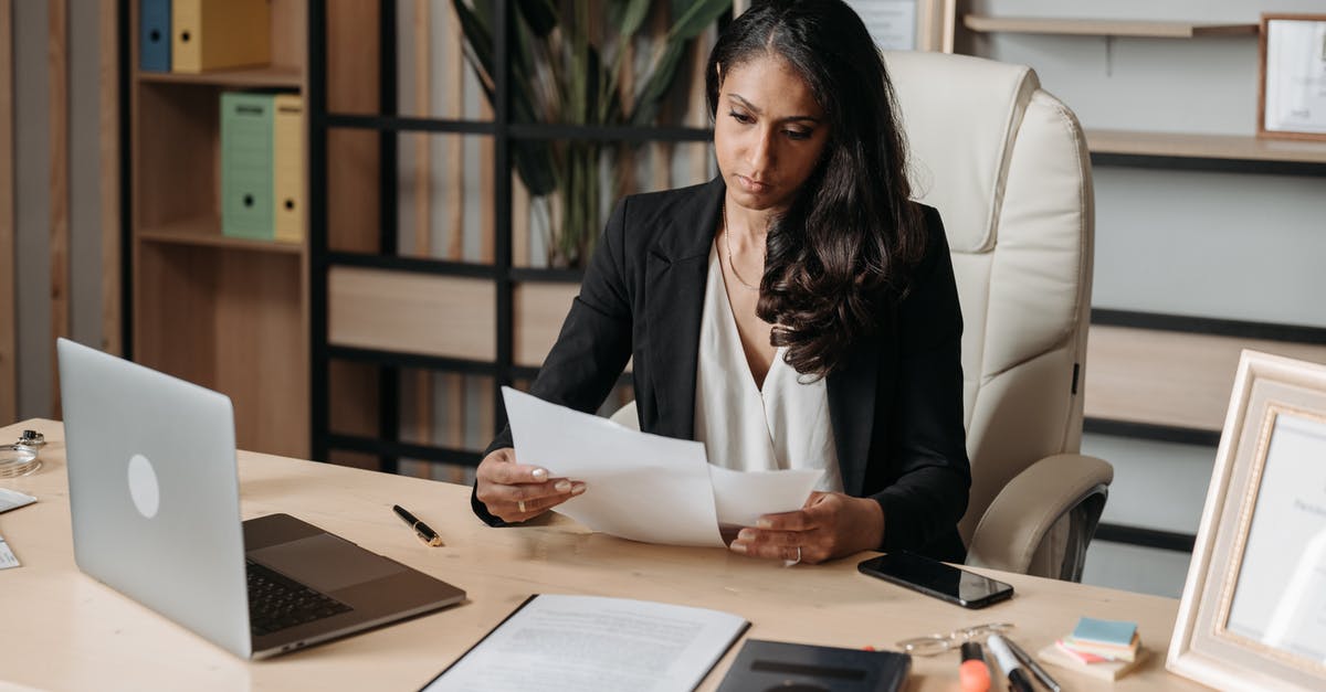 UK Visa for Indian National: Translation Requirements for Employment Contract and Salary Slips - Woman Working at the Desk in Office UK Visa for Indian National: Translation Requirements for Employment Contract and Salary Slips - Woman Working at the Desk in Office