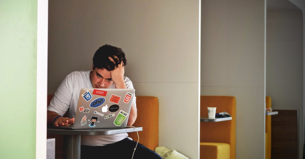 UK visa for unemployed person - Man in White Shirt Using Macbook Pro