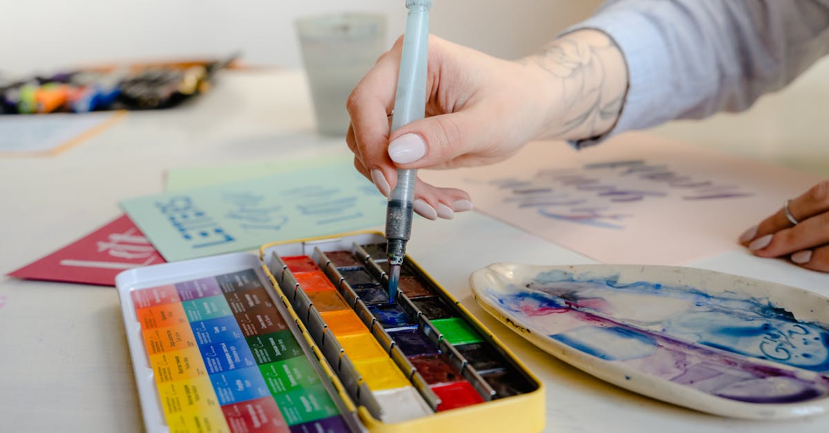 UK visa refusal letter suggests mix up of applications. What should we do? - Crop unrecognizable artist using art brush and watercolor palette