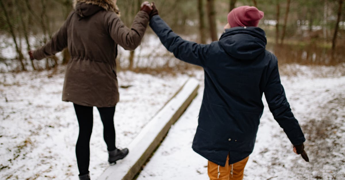 UK Visitor Visa for Girlfriend - Couple Holding Hands on a Walk in Winter