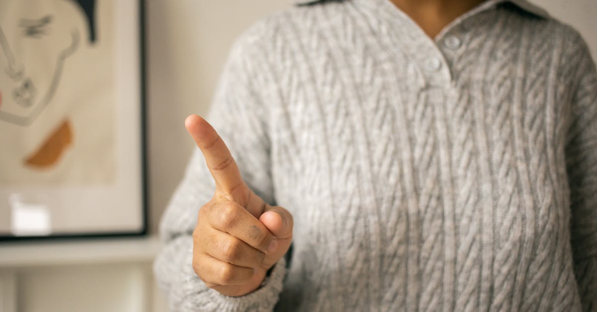 UK Visitor Visa refused. Is there any point in reapplying? - Black woman pointing finger in light room