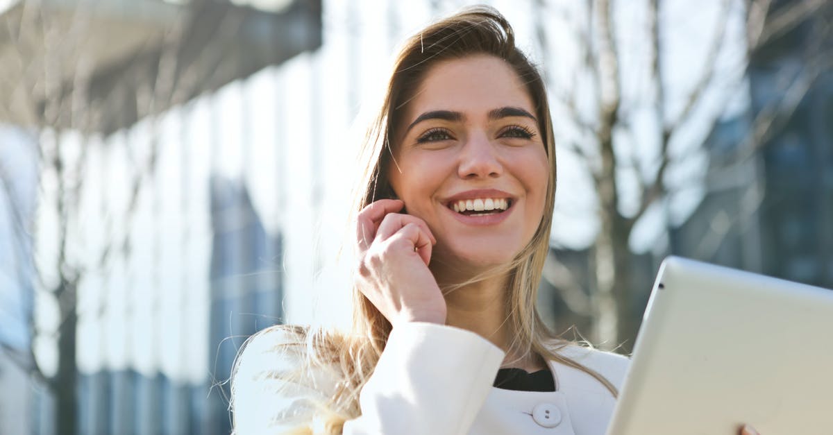 Unambiguous contact details for Japanese people - Woman In White Blazer Holding Tablet Computer