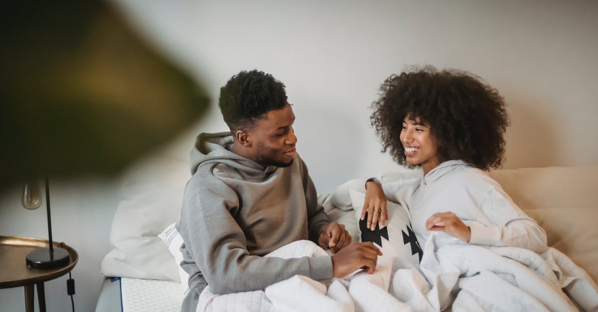 Under what circumstances are hotel room upgrades given out? [closed] - Young black couple having fun in bed