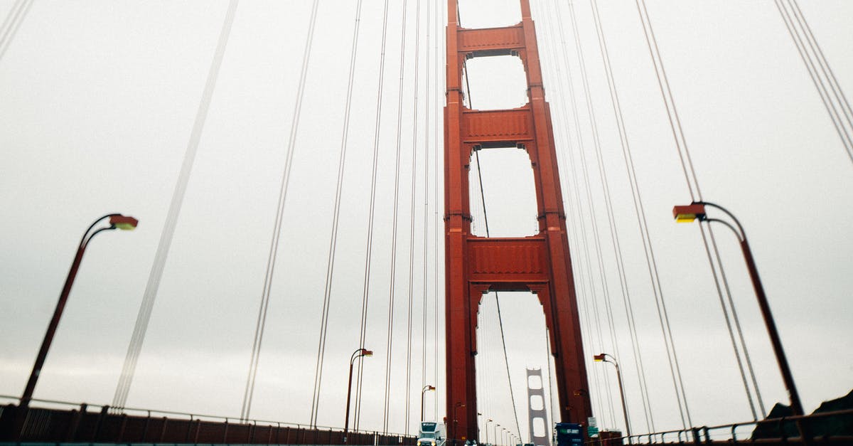 Unlimited-ride pass on San Francisco BART - Modern huge suspension bridge on overcast weather