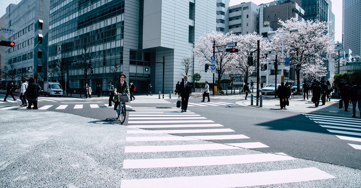 Unmarked T/Y intersection. Where do I turn left? - People Crossing Pedestrian Lane