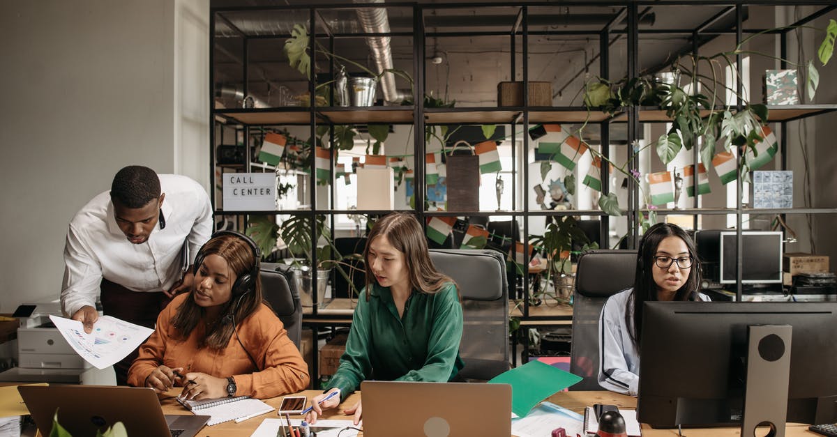 Unused Business visa - Man in Black Jacket Sitting Beside Woman in Brown Jacket