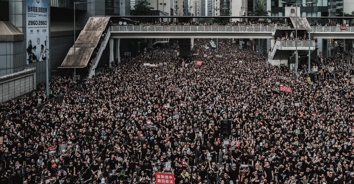 Upcoming stopover at Hong Kong what to do about the protests? - Group of People Protesting on the Street