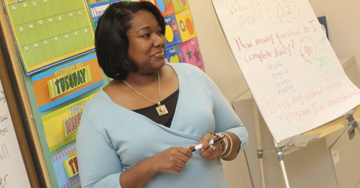 Upgrading to a first class [closed] - Photo of Woman Teaching