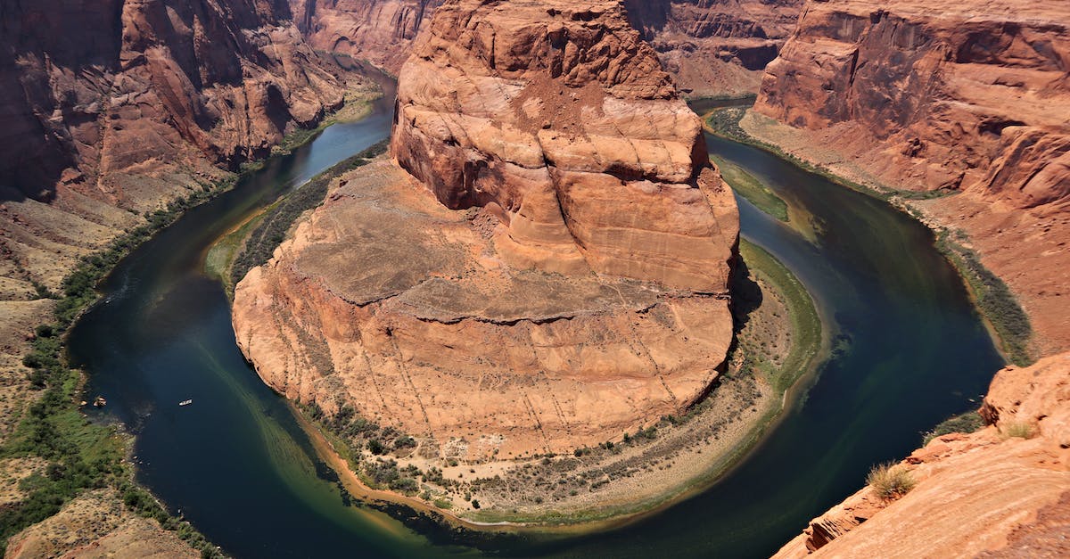 US Customs Pre-clearance in foreign airports - Brown Rock Formation Beside Green Water