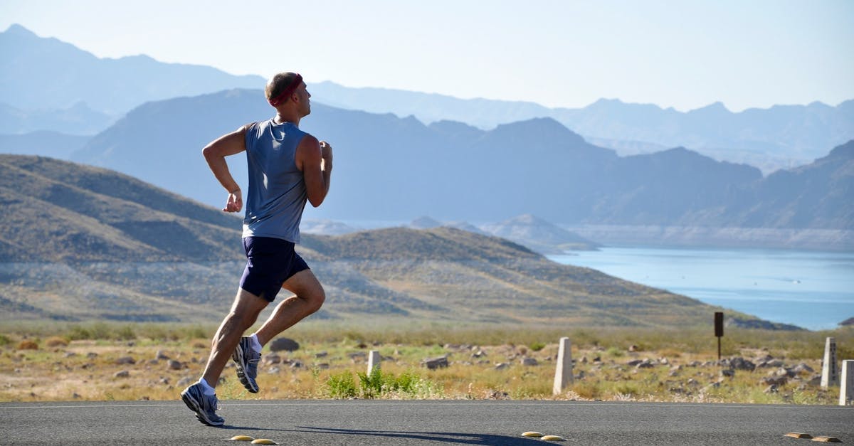 U.S. Health Insurance for road warriors - Man Running on Side of Road