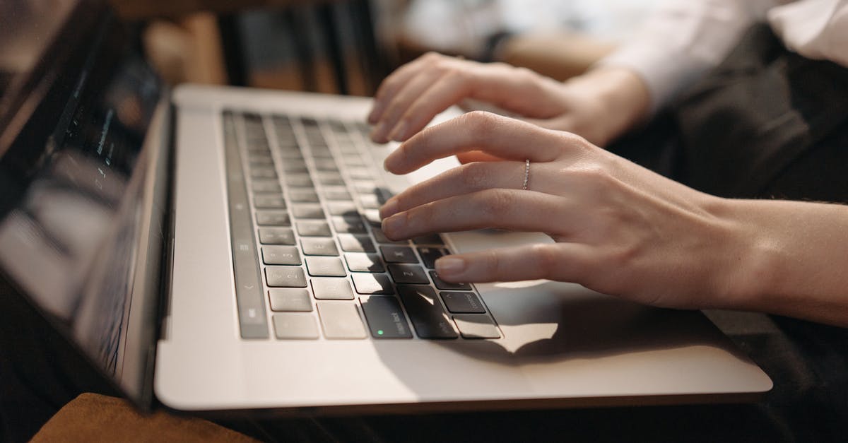 Using a Schengen visa from the Spanish embassy in Greece? [duplicate] - Close-Up Shot of a Person Using a Laptop